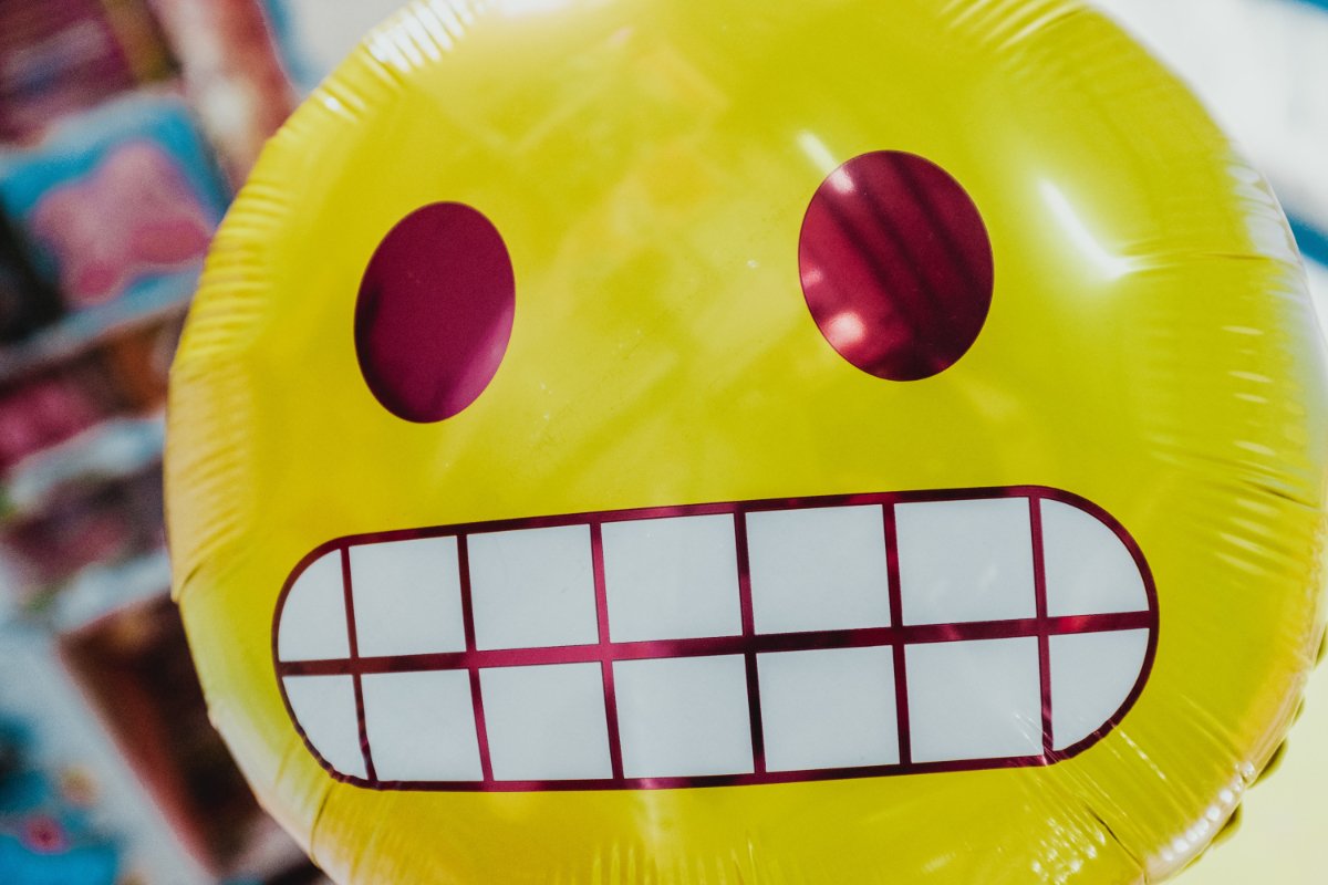 photograph of a ballon with a smilie face impression by bernard-hermant-bSpqe48INMg-unsplash