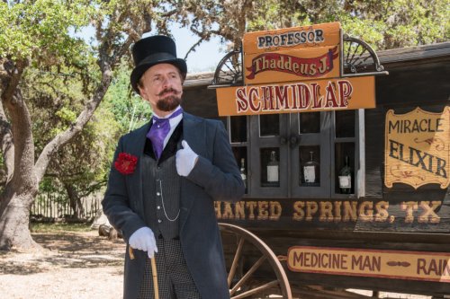 Snake-oil_salesman_Professor_Thaddeus_Schmidlap_at_Enchanted_Springs_Ranch,_Boerne,_Texas,_USA_28650a  "Professor Thaddeus Schmidlap" (historical intrepreter Ross Nelson), the resident snake-oil salesman at the Enchanted Springs Ranch and Old West theme park, special-events venue, and frequent movie and television-commercial set in Boerne, Texas, northwest of San Antonio.